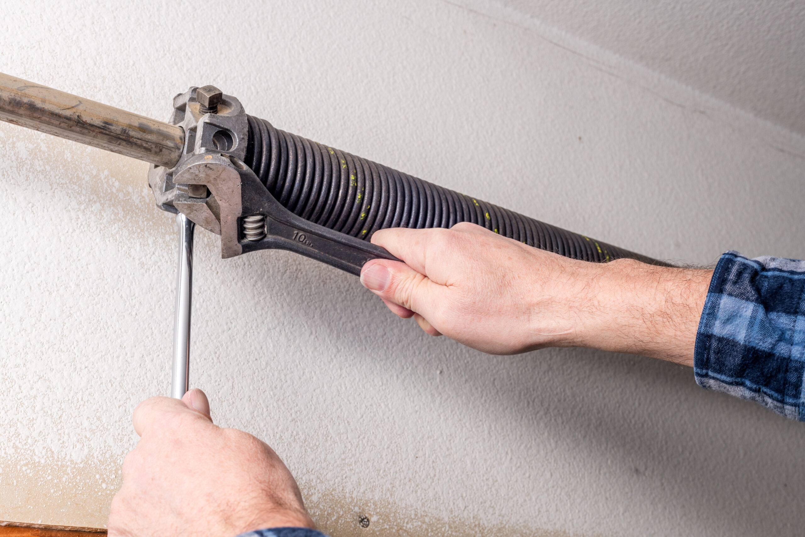 Repair man working on garage door