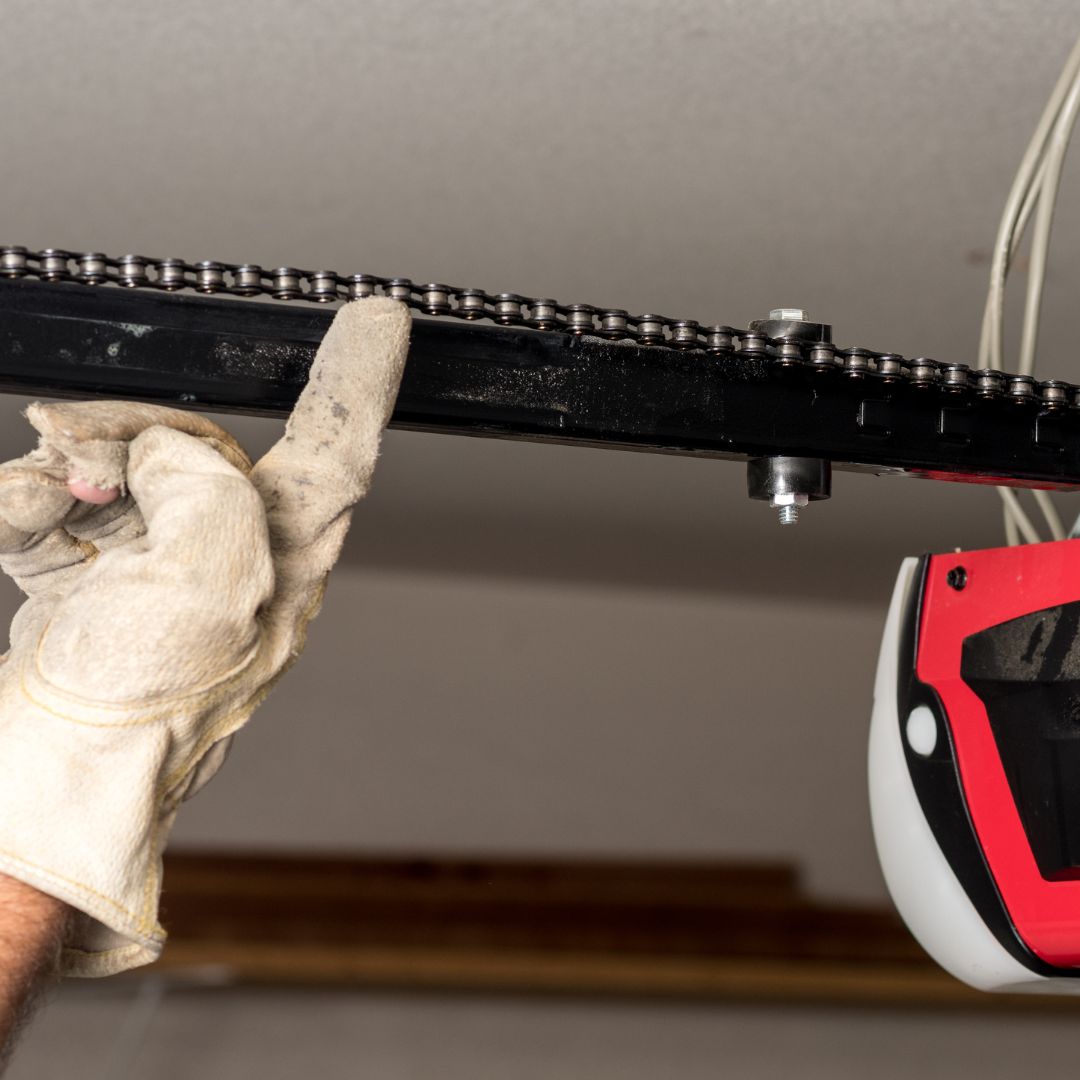 Repair man working on garage door