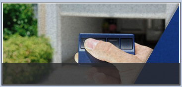 a garage door remote in hand