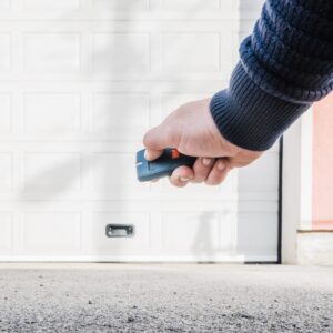 a garage door remote in hand
