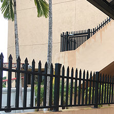 black iron fence around commercial area